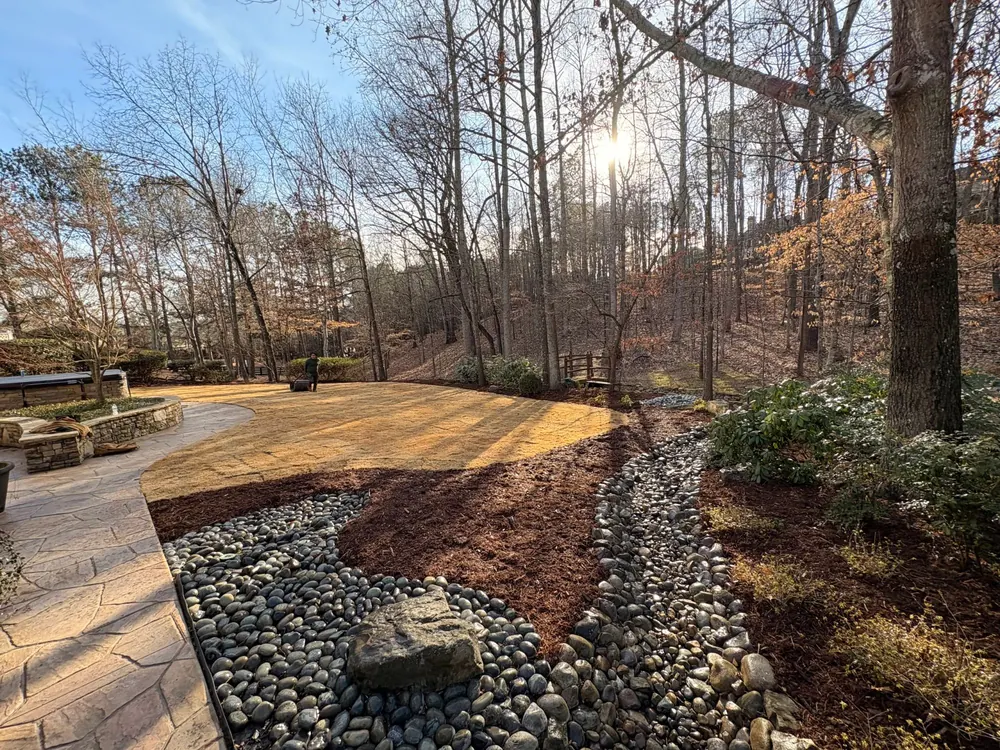 River-rock border along a refreshed bed