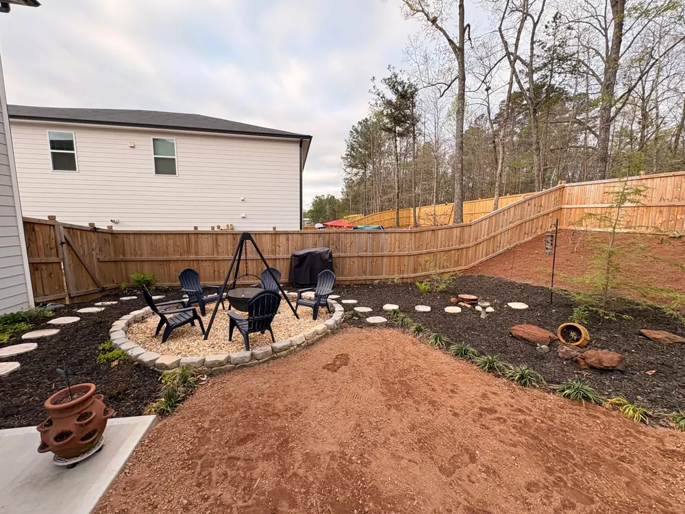 Backyard firepit area with new landscaping